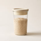Peak Dough starter jar with sensor lid and risen sourdough starter